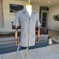 a two-piece gray safari suit made from vercelli italian fabric