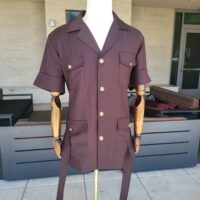 a two-piece burgandy safari suit made from vercelli italian fabric